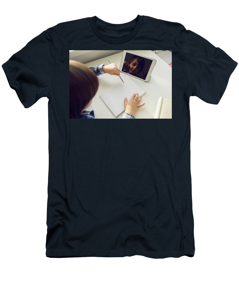 1 Boy Child Sits At a Desk and Learns with a Tablet Notebook and Book Elena Saulich T-Shirt