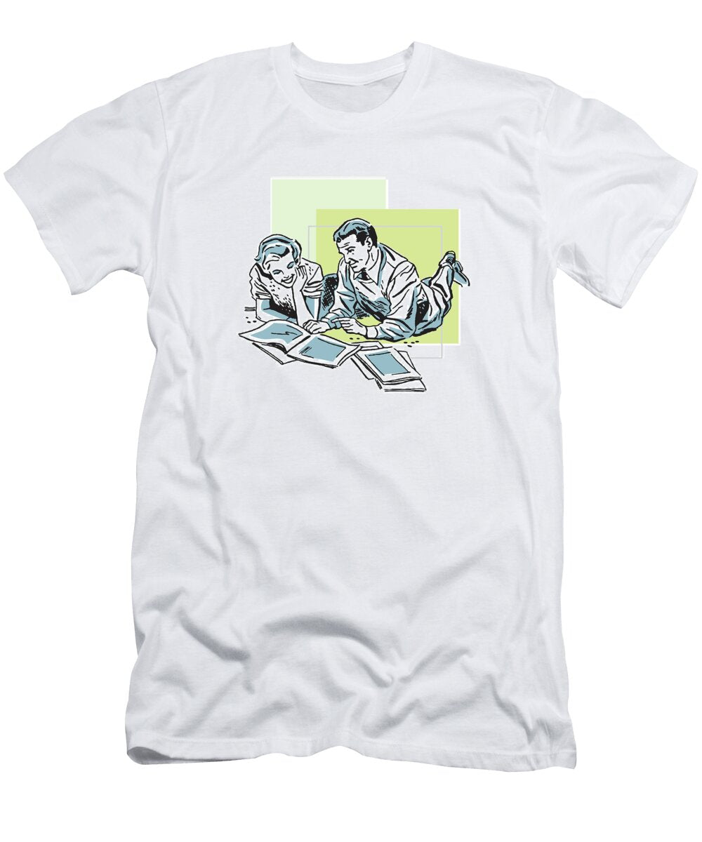1 Couple Looking At Magazines Together Csa Images T-Shirt