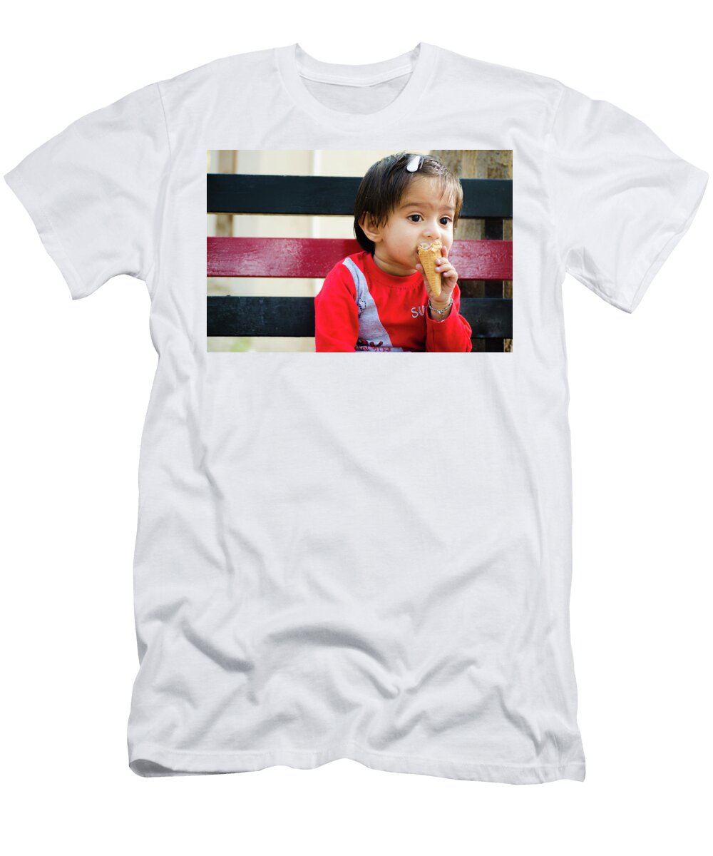 1 Little Girl Sitting on a Bench and Eating an Ice Cream Cone Shilpa Panchal T-Shirt