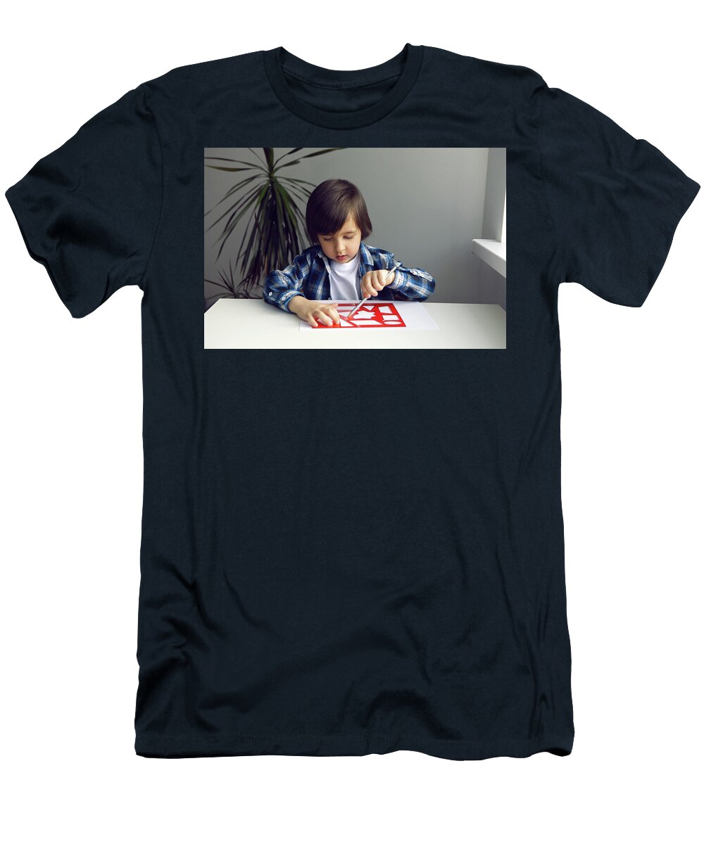 2 Boy Child Draws on Paper with a Ruler on a Table Sitting By the Window Elena Saulich T-Shirt