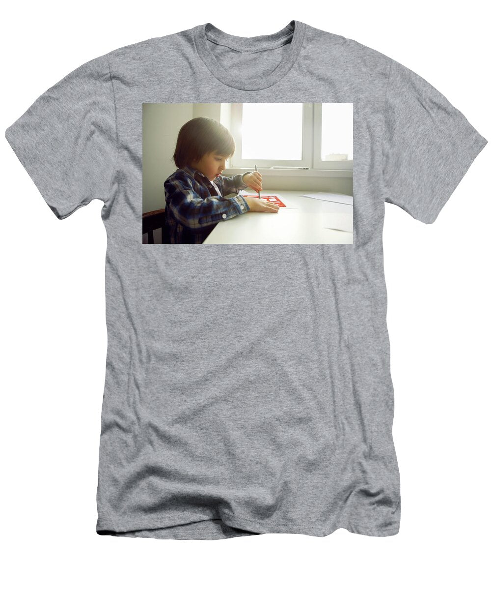3 Boy Child Draws on Paper with a Ruler on a Table Sitting By the Window Elena Saulich T-Shirt