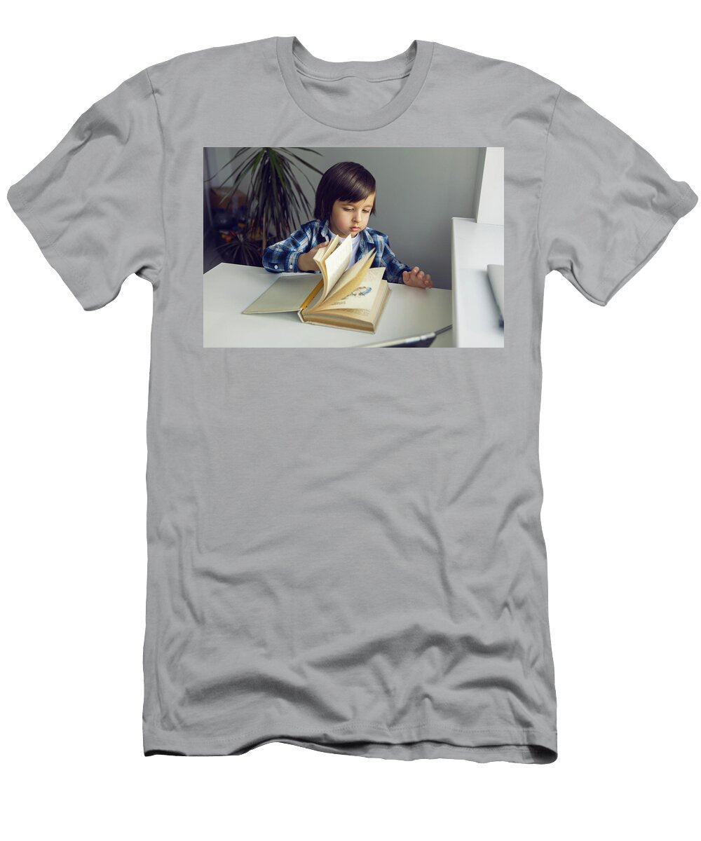 3 Boy Child Sits At a Desk and Learns with a Tablet Notebook and Book Elena Saulich T-Shirt