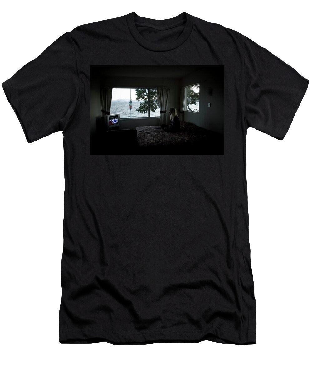A Woman Watches Tv in Her Hotel Room Elyse Butler T-Shirt