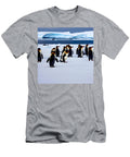 Footprints of Resilience the Captivating Penguins of the Serene Shoreline Evan Brown T-Shirt