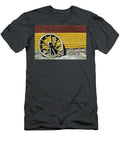 Old Wooden Wheel Against a Wall Dan Radi T-Shirt