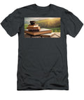 Stack of Old Books and Coffee Cup on Outdoor Wood Table with Lan Turgay Koca T-Shirt
