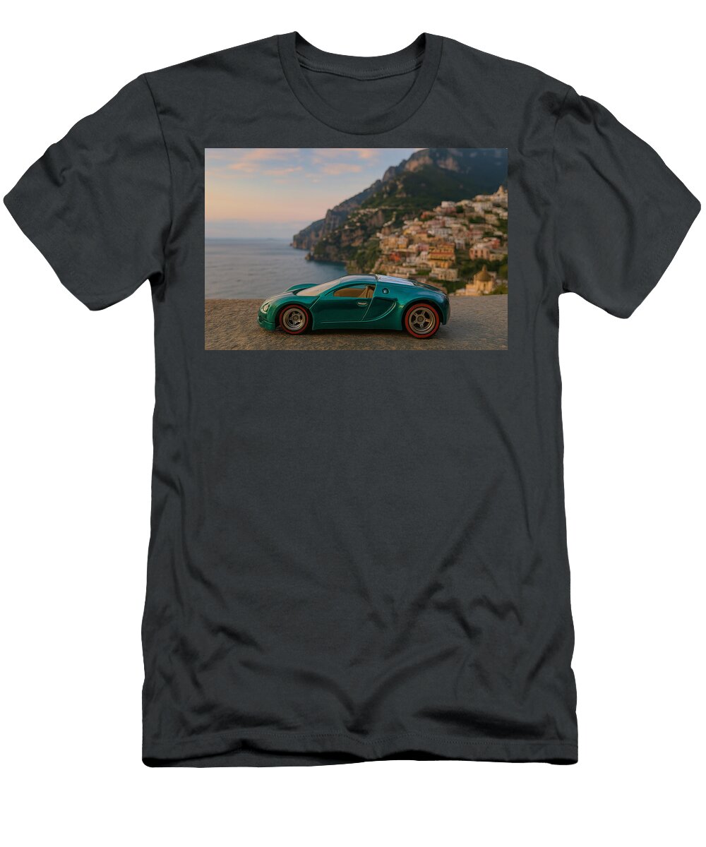 Toy Car Overlooking Cliffside Village Bruce Roker T-Shirt